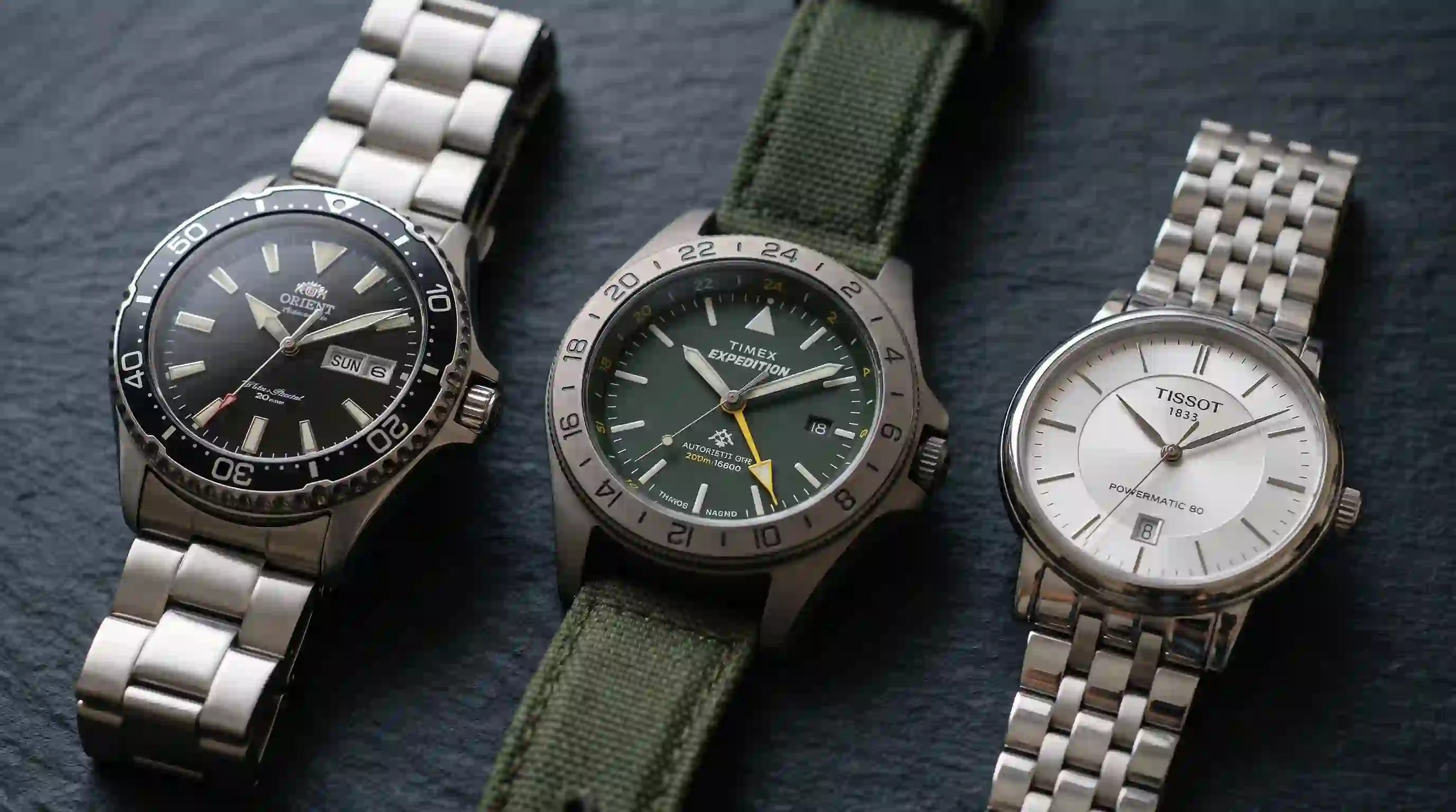 Orient Timex Tissot naast elkaar